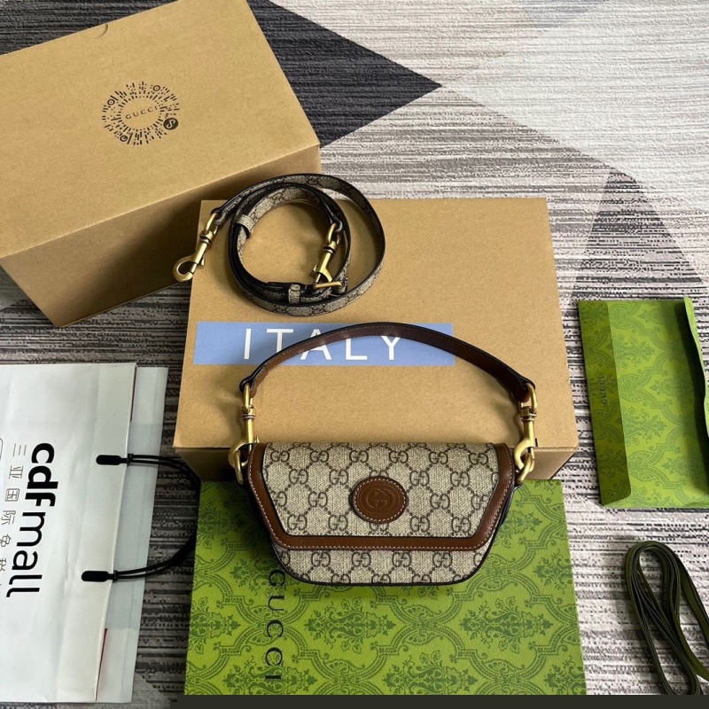 G*u*i top handle bags